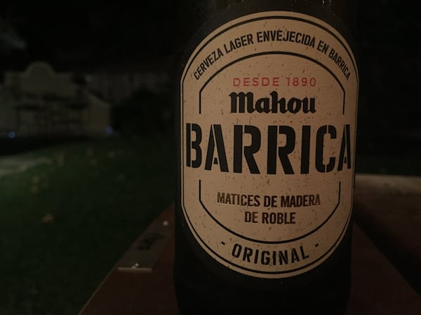 Mahou Barrica beer bottle outdoors in the evening