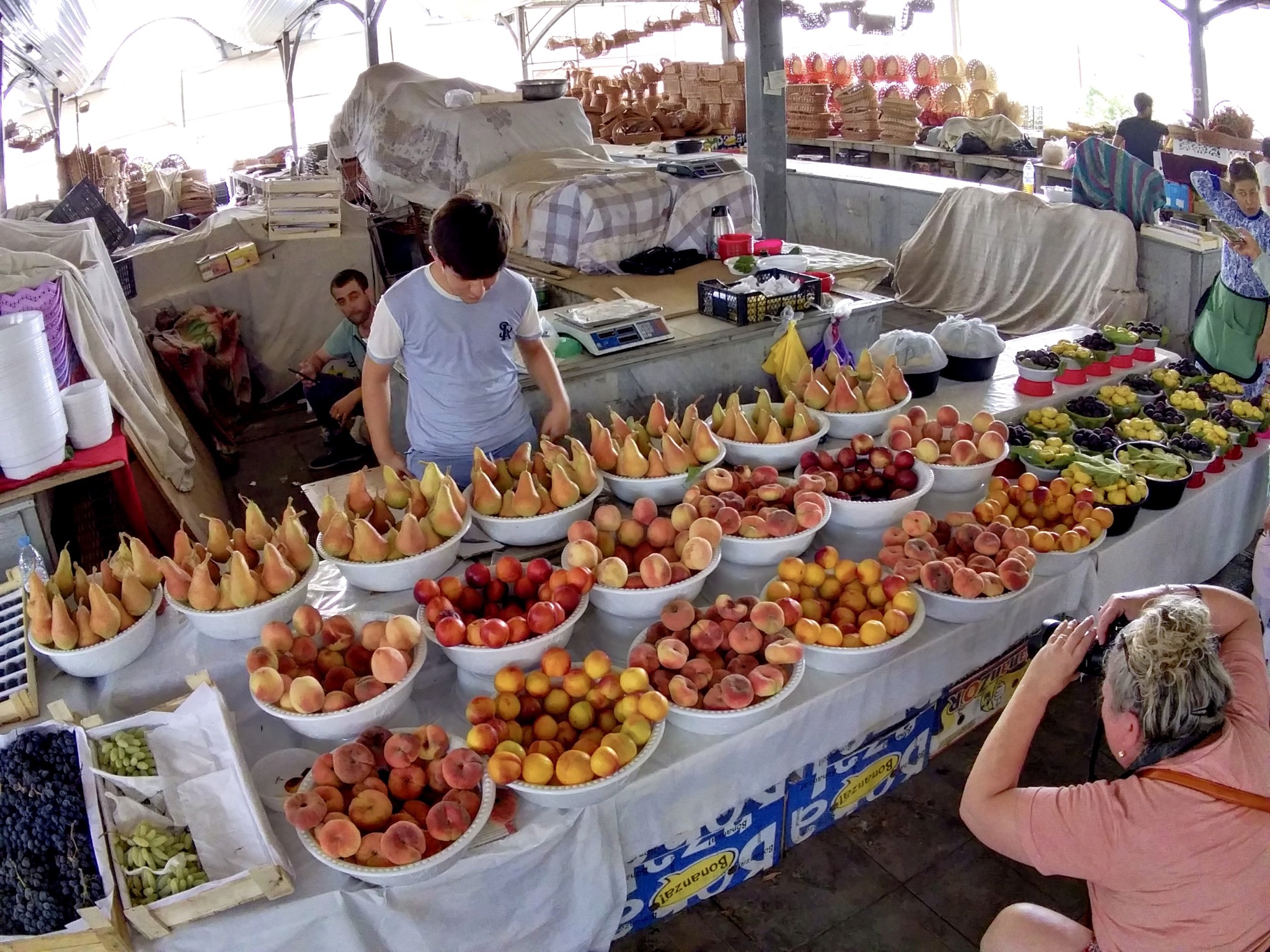 A market stand with lots of fruit